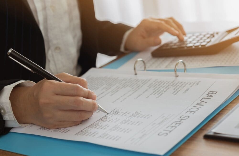 Business women reviewing data in financial statement